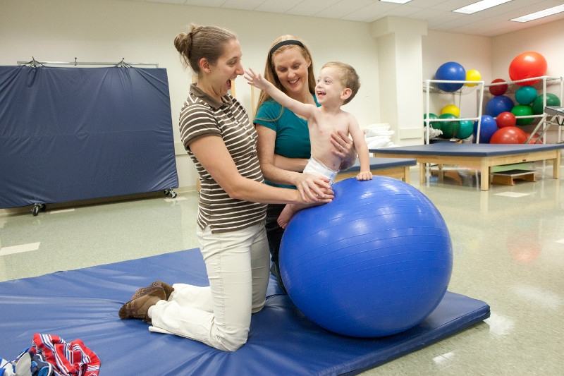 Student and faculty in pediatric lab